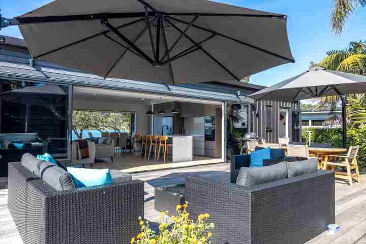 Back deck lounge area at Piritahi Beach House by Waiheke Unlimited v2