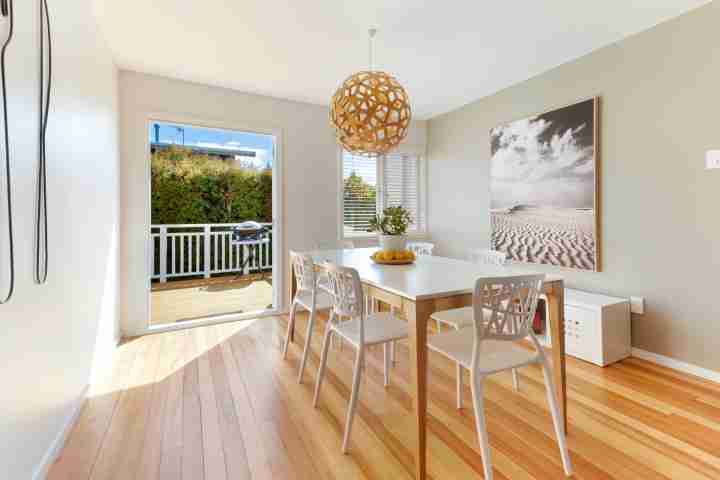 Sunny, family dining area with sunny outdoor deck and BBQ at Eight on Church, Waiheke Island