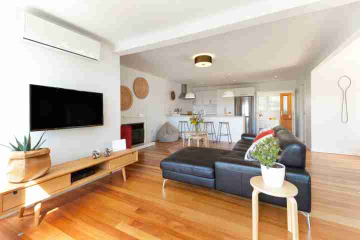 Spacious, modern, open-plan lounge, dining and kitchen area at Eight on Church, Waiheke Island
