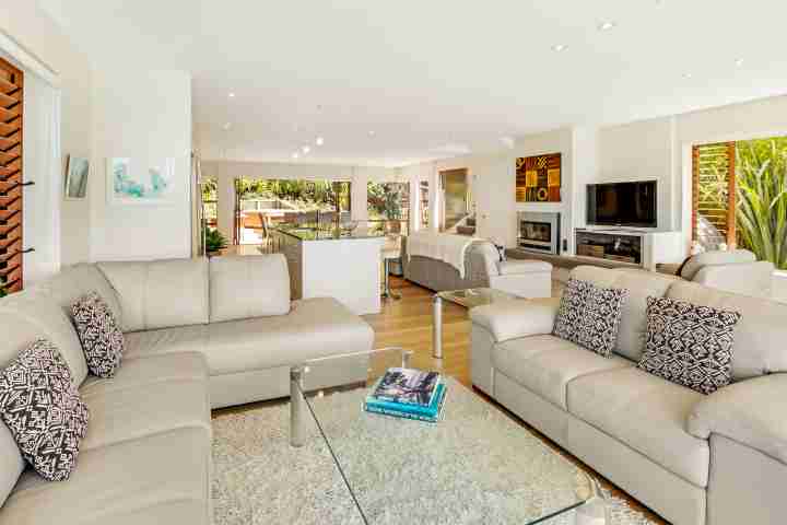 Stay Waiheke style in open plan living with sliding doors to deck, Enclosure Bay