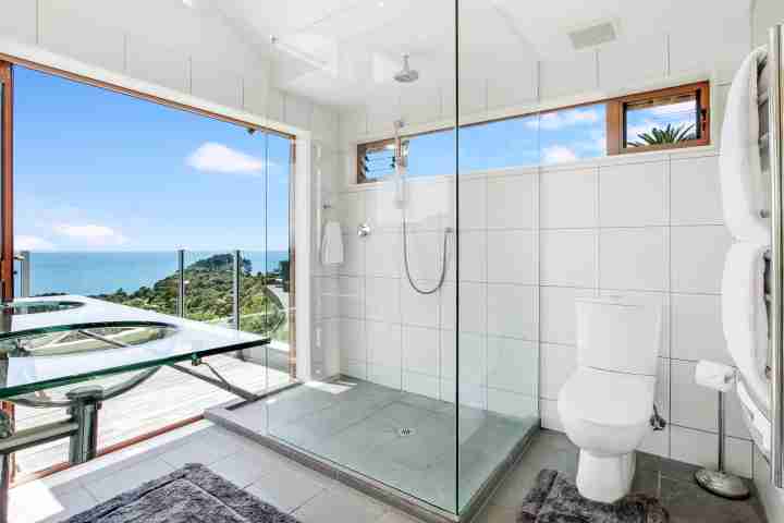 Hauraki Villa Master ensuite with walk in shower, twin sinks, sea views and balcony access