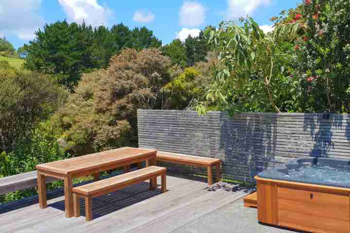 Private spa pool sheltered in New Zealand bush at your Waiheke home away from home