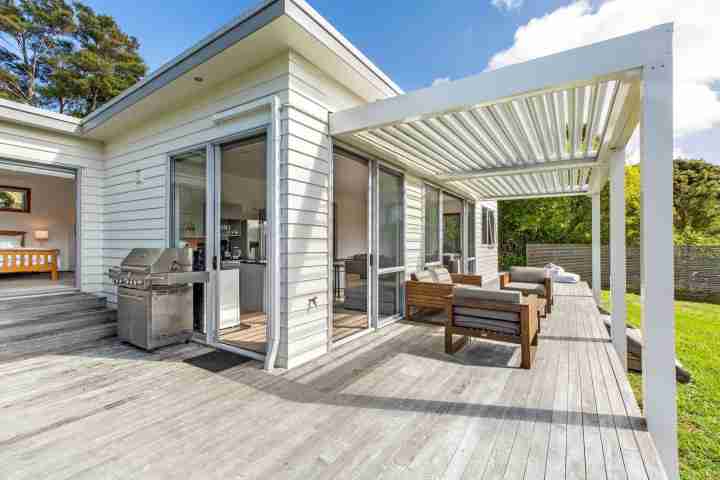 Spacious deck, outdoor seating, lawn and family BBQ area for your Waiheke Island escape