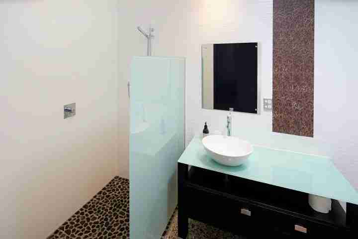 Walk in shower in modern bathroom in private luxury of Korora Estate, Waiheke Island