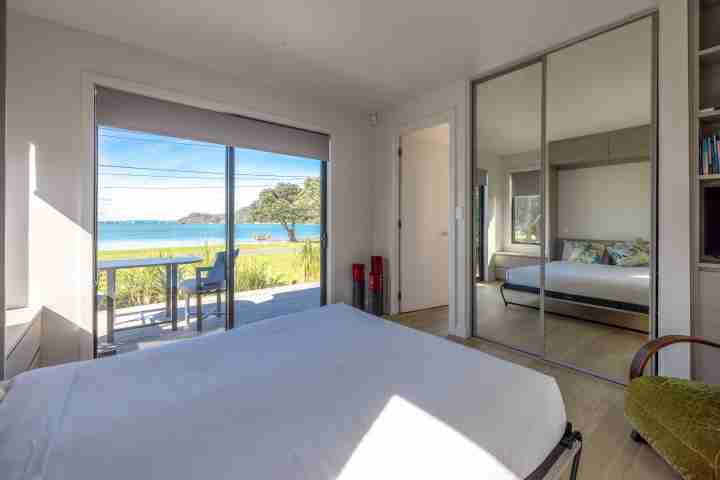 Queen bedroom at Piritahi Beach House by Waiheke Unlimited