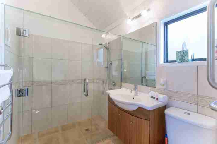 Modern bathroom with walk in shower, couples holiday accomodation Waiheke